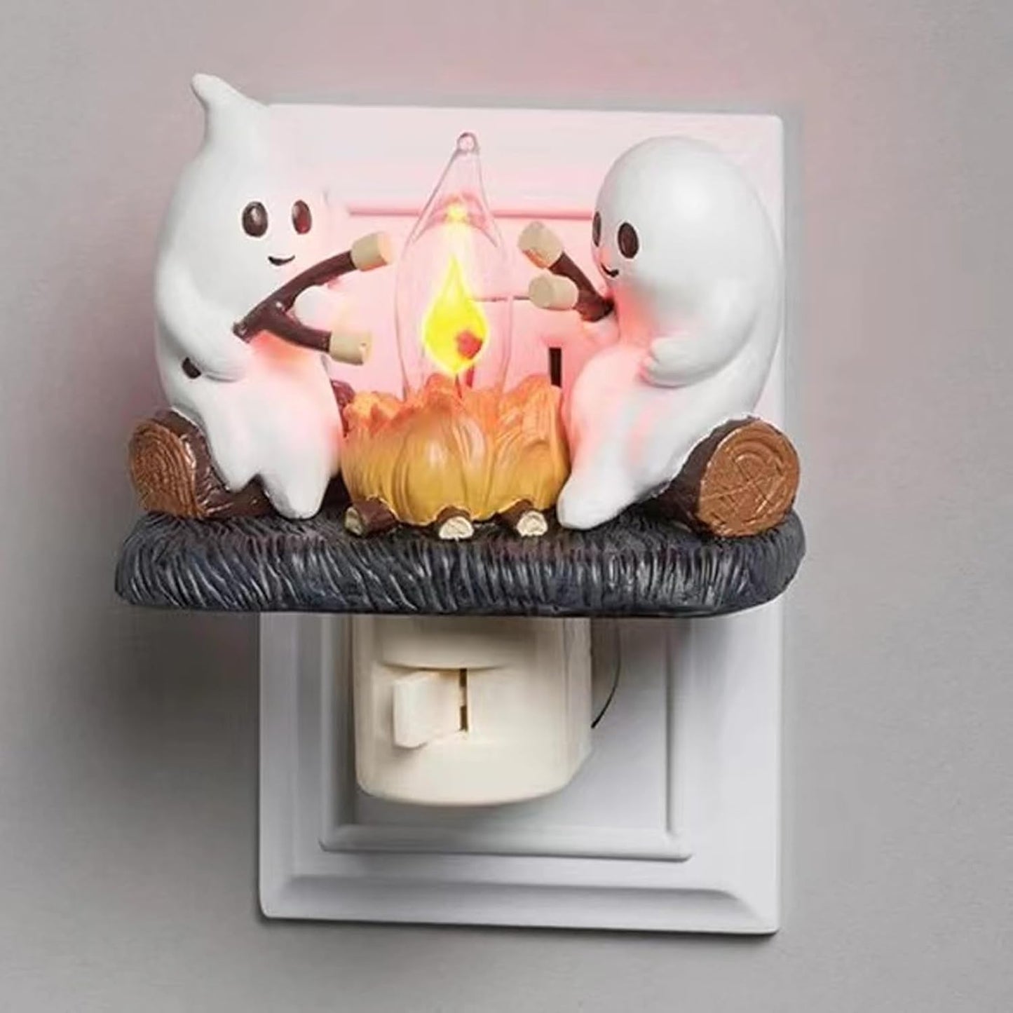 Chase away the chills with the Campfire Haunt Flicker Nightlight