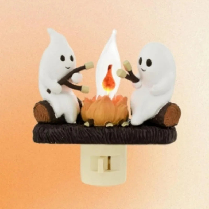 Chase away the chills with the Campfire Haunt Flicker Nightlight